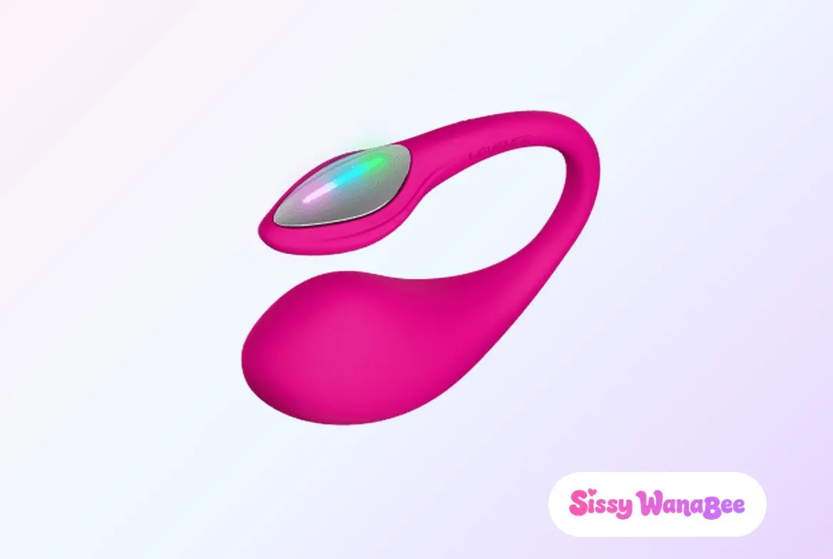 Studio product shot of the Lovense Lush 4 in deep magenta silicone against a soft pink and lavender gradient, the teardrop bulb hanging below a slim tail arching over it, an iridescent oval plate set into the head, the quiet intimacy of a wearable toy chosen for a long evening
